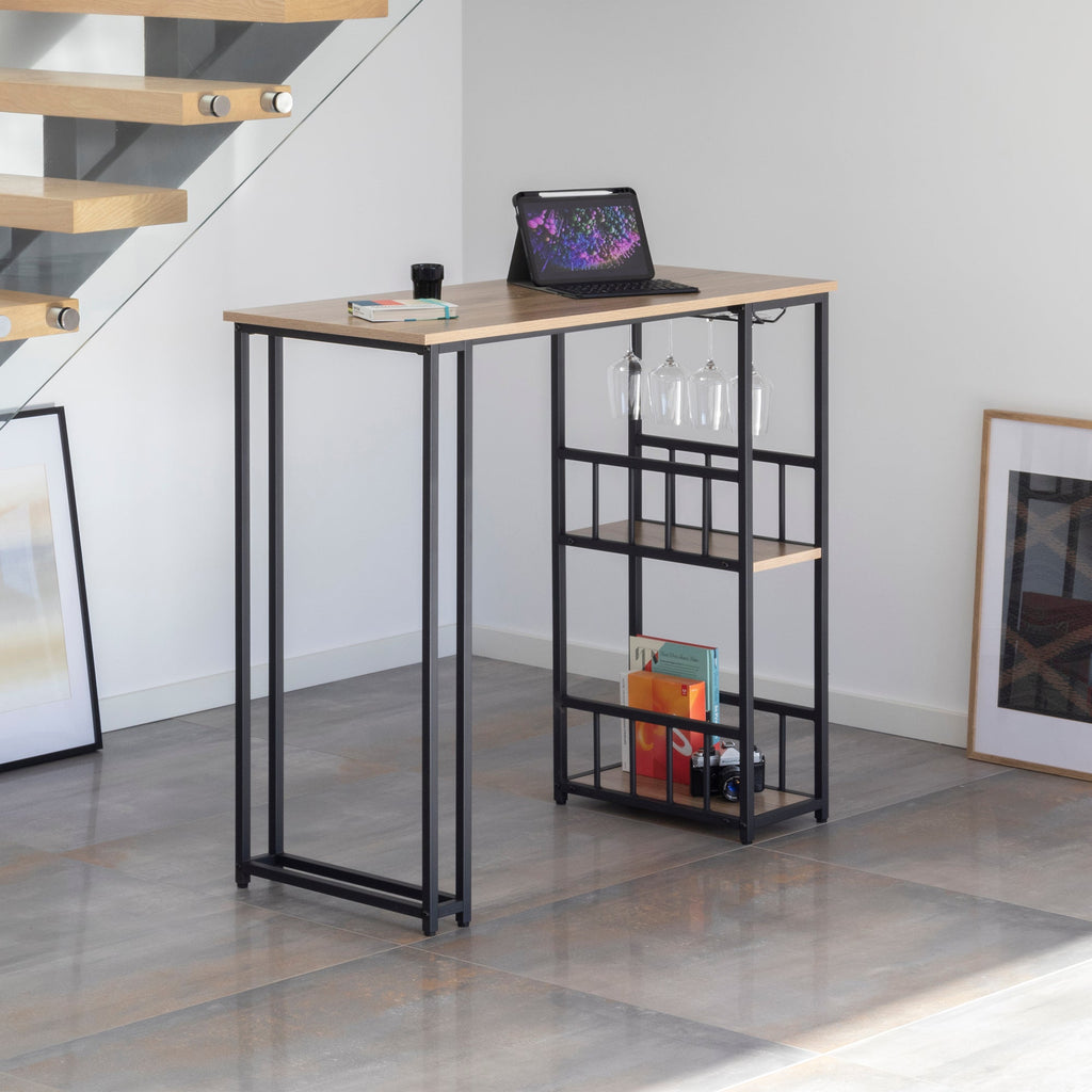 GAVIN - Mesa de bar 110x50 cm, altura 105 cm, con 2 estantes y portacopas, estructura de acero, estilo industrial, negro