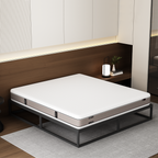 Mattress on a metal frame in a modern bedroom setting
